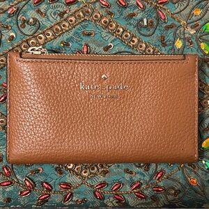 kate spade pebbled leather bifold wallet